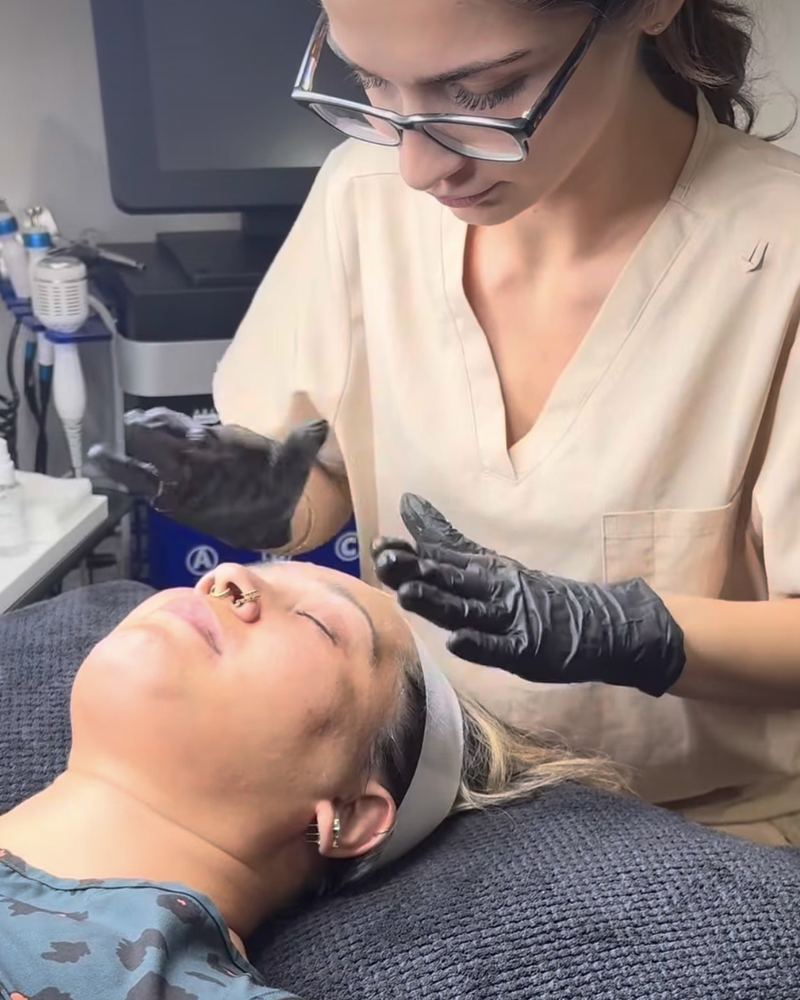A client relaxing on the treatment couch at Glow By Yaz after a facial
